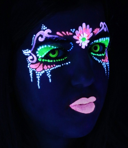Photo of Cool makeup glowing under black light