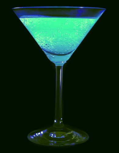 Photo of Tonic Water glowing under black light