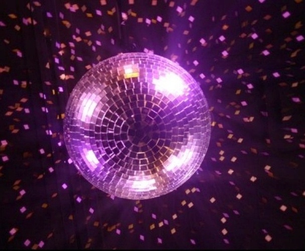 Photo of Mirror/Disco Ball with magenta light at Hotel Arts