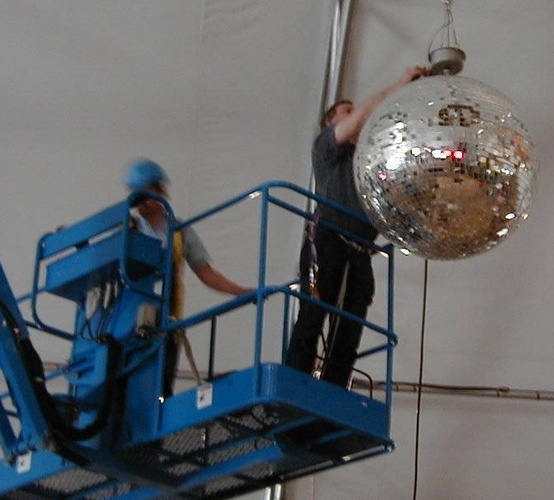 Photo of Setting up a large mirror/disco ball at Calgary Stampede
